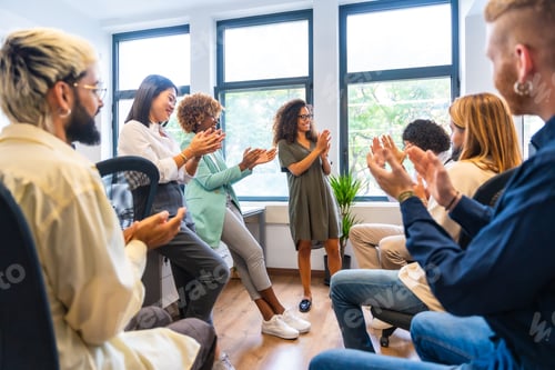 Preview: Successful coworkers applauding and celebrating a goal
