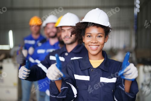 Preview: Confident Technicians and engineering team in the factory