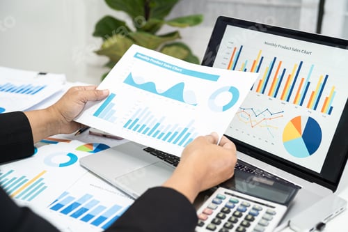 Preview: Asian accountant working and analyzing financial reports project accounting with chart graph.