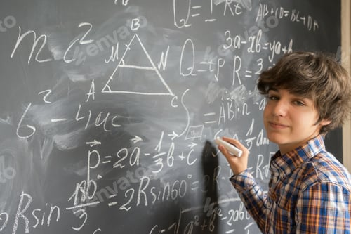 Preview: Boy writting on black board