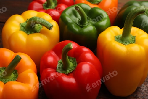 Preview: Fresh colorful bell peppers on table, closeup