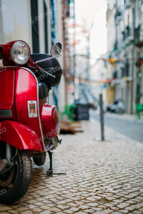 Preview: Red scooter parked in a street of Lisbon