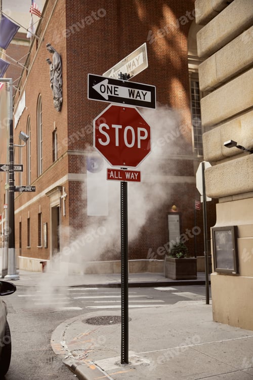 Preview: road signs near steam and vintage buildings in downtown of new york city, metropolis environment