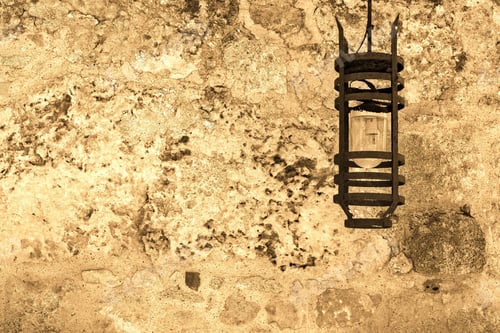 Preview: One Steel Lamp On An Ancient Stone Wall Of Color Sepia