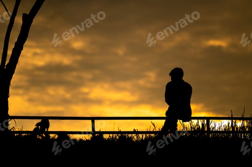 Preview: Silhouette of a man golden sunset