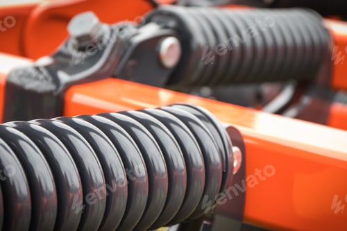 Preview: Steel black spring as part of agricultural machine. Technology