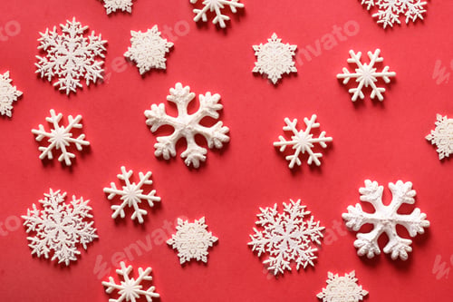 Preview: Christmas snowflakes of different shape mold on red. Xmas holiday.