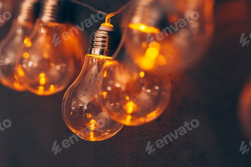 Preview: Garland of light bulb lamps in the dark