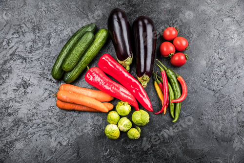 Preview: different fresh seasonal vegetables on black table top background
