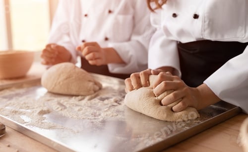 Preview: Crop baker apprentices kneading dough