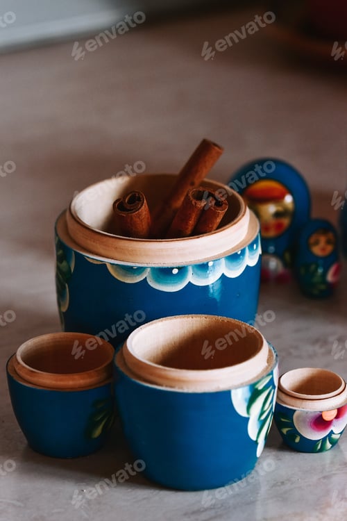 Preview: Vertical shot of cinnamons in a Russian matryoshka doll
