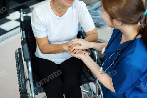 Preview: Female doctors shake hands with patients encouraging each other.