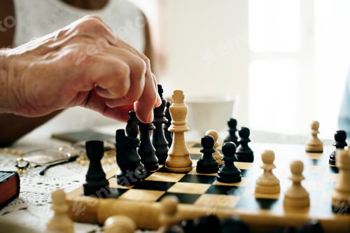 Preview: Senior friends playing chess together