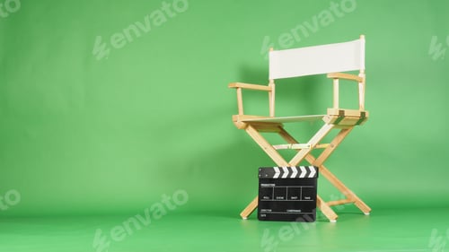 Preview: White Director chair with clapper board and megaphone on green screen background.