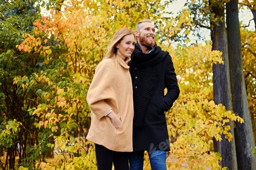 Preview: Bearded male hugs the cute blonde female on the date.