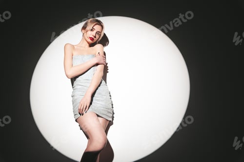 Preview: Beautiful blond woman in studio