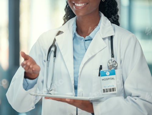 Female Doctor Using Tablet in Hospital Workplace