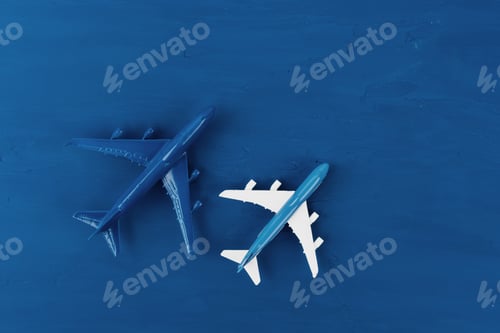 Preview: Toy plane on classic blue background, top view