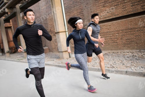 Preview: Young friends jogging outdoors