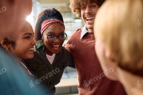 Preview: Happy black student having fun with her friends at the university.