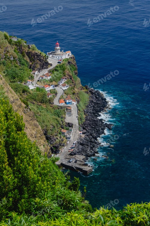 Preview: Vertical shot of Arnel Lighthouse by the sea in Sao Miguel, Azores