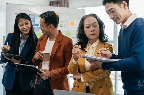 Preview: Group of Young Asian business team creative businesspeople coworker in office.