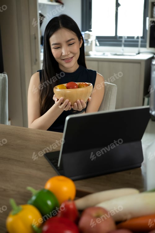 Preview: Pretty millennial woman preparing ingredients for making healthy salad.