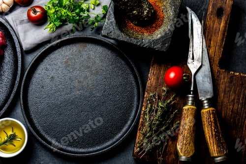 Preview: Raw fresh meat steak beef tenderloin, herbs and spices around frying pan plate