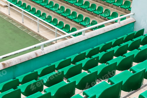 Preview: Rows of green diagonal spectator seats with no people in it