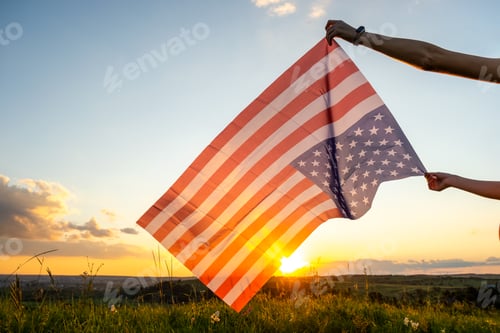 Preview: Patriotic Flag Waving at Sunset over Rural Field