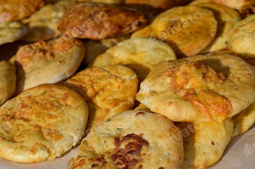 Preview: Hungarian street food - langos. Flatbread with sour cream-garlic sauce and cheese