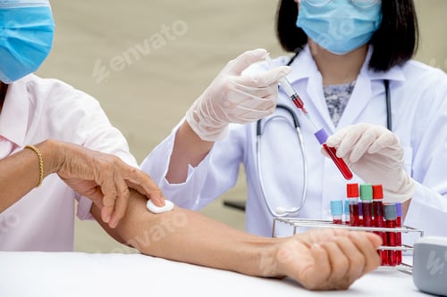 Preview: A doctor hands with a syringe and a sample of blood tube for analysis and test virus disease
