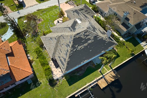 Preview: Hurricane Ian destroyed house roof in Florida residential area.