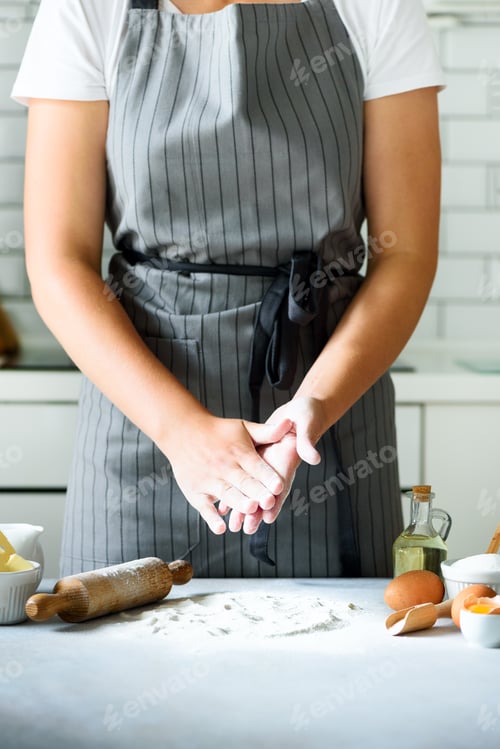 Preview: Female hands kneading dough, baking background. Cooking ingredients - eggs, flour, sugar, butter