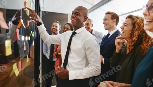 Preview: Diverse work colleagues brainstorming with sticky notes in an office