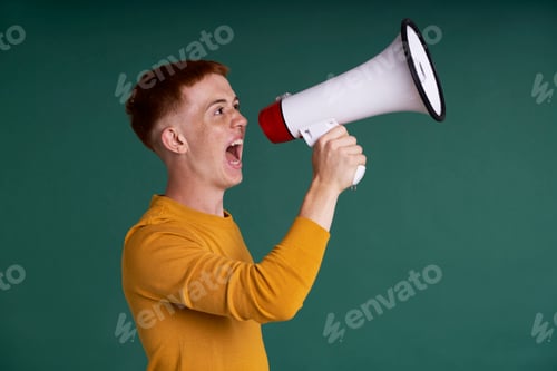 Preview: Caucasian red head teenager screaming through a megaphone