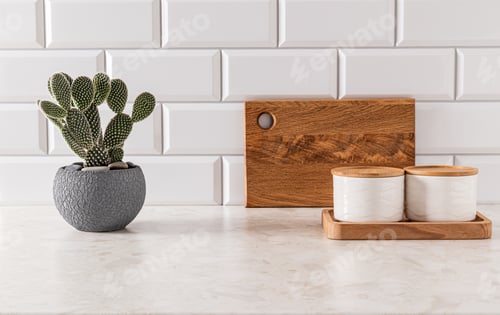 Preview: Two stylish ceramic jars for storing bulk food on a kitchen countertop with trendy opuntia cactus