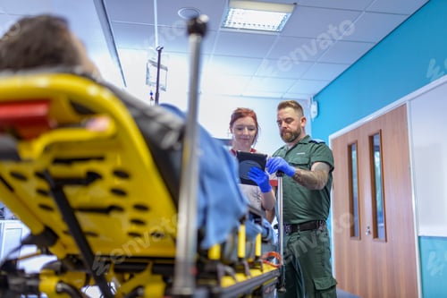 Preview: Emergency paramedics handing over patient to emergency nurse