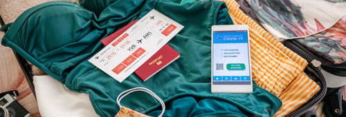 Preview: Open suitcase with woman luggage for beach vacation and covid pa