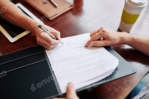 Preview: Business people signing agreement