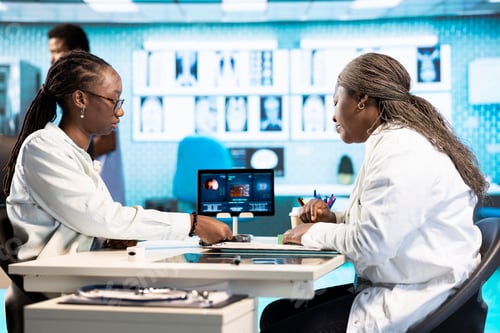 Preview: Black female patient buying medicaments and vitamins on POS terminal