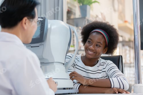 Preview: young woman african american examining eyesight modern measurement machine equipment by eye speciali
