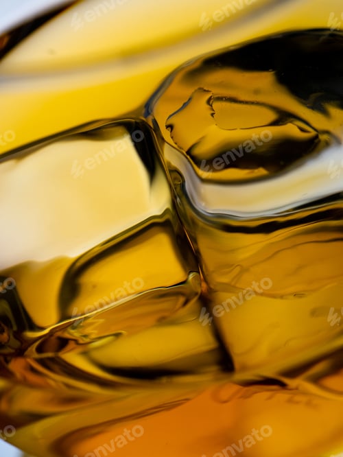 Preview: Glass of whisky with ice cubes, close-up shot