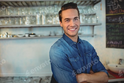 Preview: Metal shelves holding clean glassware and cups against concrete wall behind counter