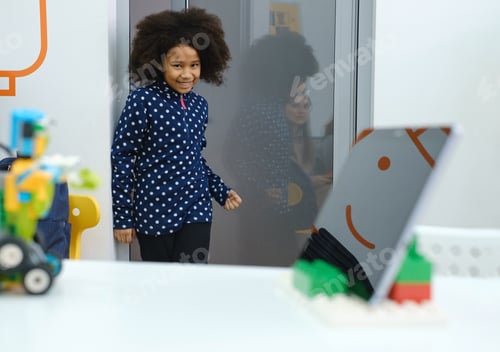 Preview: Black Girl at school entering class for lesson