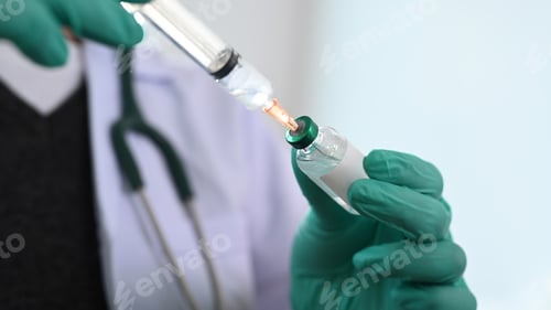 Preview: Doctor or nurse wearing medical glove holding syringe and vaccine preparing for injections.