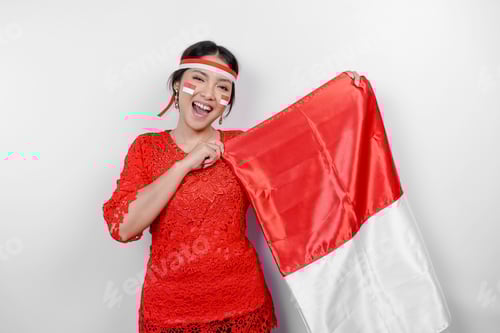 Preview: Enthusiastic Woman Holding Red and White Flag Indoors