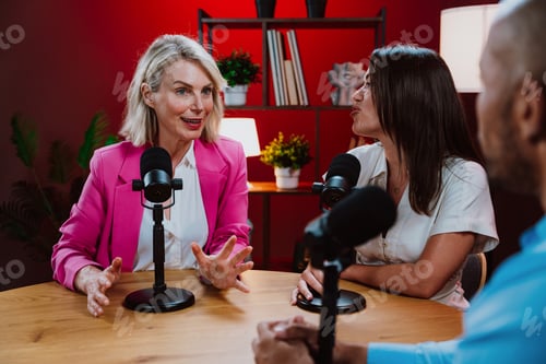 Preview: Content creators broadcasting live podcast interview using microphones