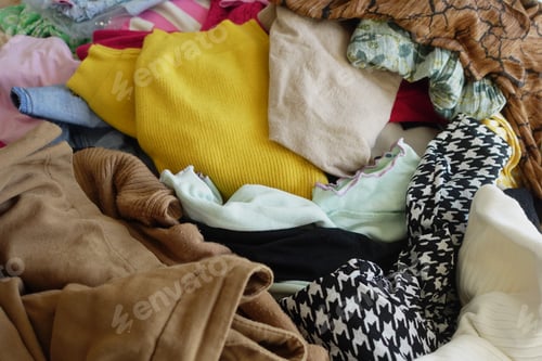 Preview: A Colorful and Textured Pile of Various Clothing Perfect for Fashion Design Inspiration