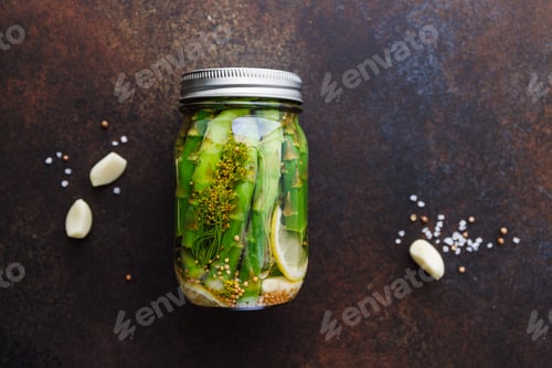 Preview: Top view of pickled asparagus in a jar